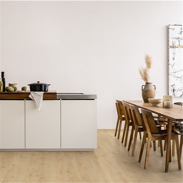 white kitchen with a beige laminate floor